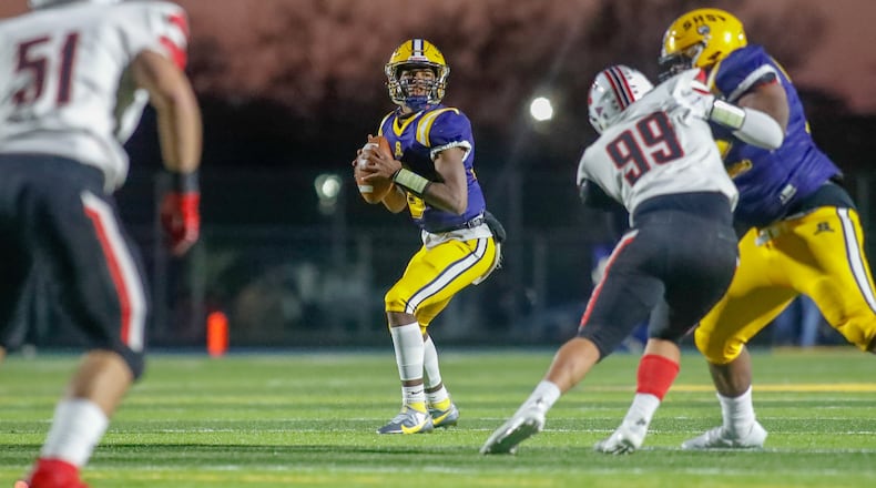 Springfield High School junior quarterback Te'Sean Smoot throws the ball during the Wildcats 31-19 victory over Wayne on Friday night in Springfield. Michael Cooper/CONTRIBUTED