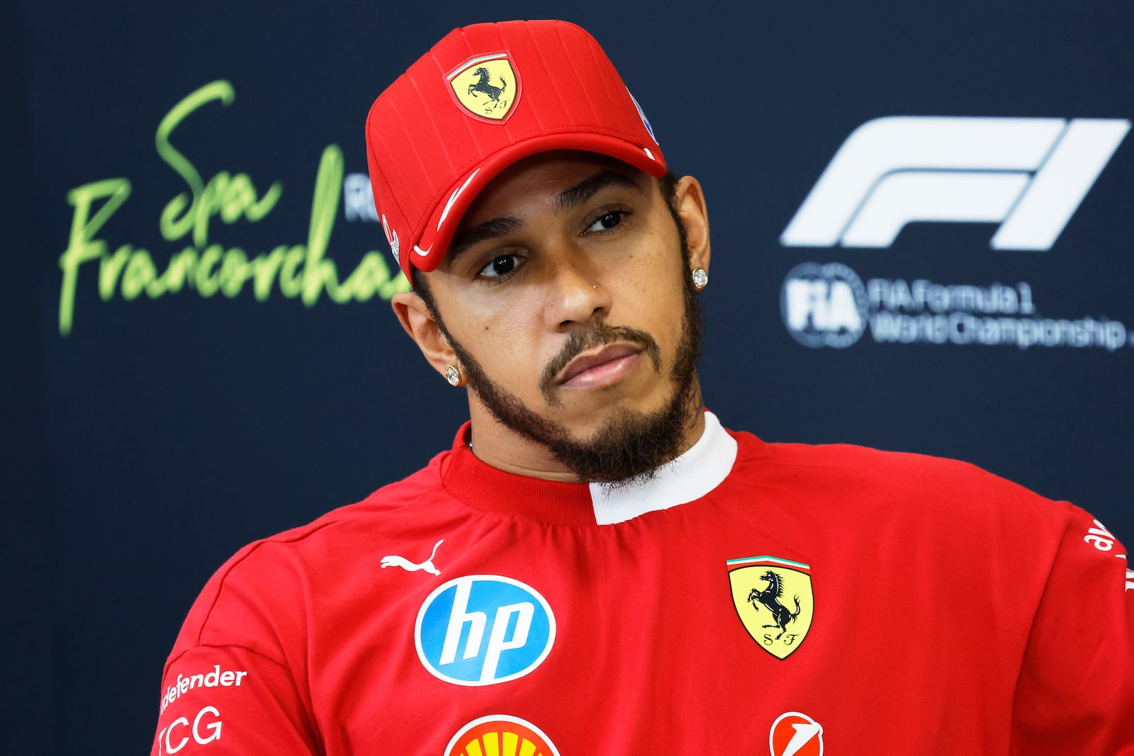 Ferrari driver Lewis Hamilton of Britain attends a media conference ahead of the Formula One Grand Prix at the Spa-Francorchamps racetrack in Spa, Belgium, Thursday, July 24, 2025. (AP Photo/Geert Vanden Wijngaert)