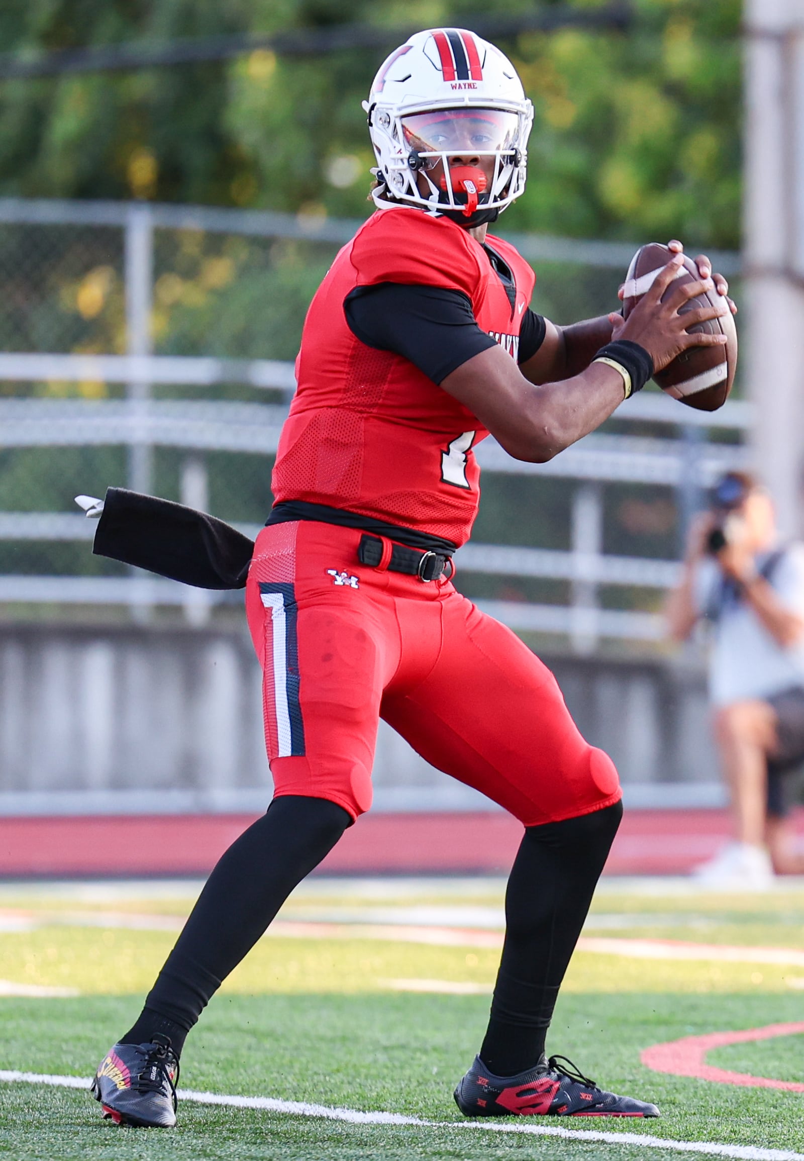 Wayne sophomore quarterback Kye Graham throws a pass during a Greater Western Ohio Conference game against Springboro on Friday, Sept. 12 at Heidkamp Stadium. BRYANT BILLING / STAFF