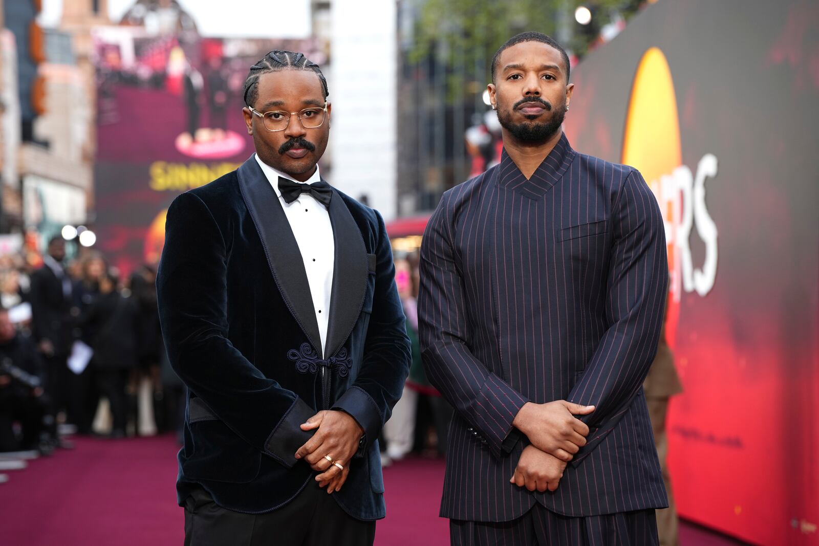 Director Ryan Coogler, left, and Michael B. Jordan pose for photographers upon arrival at the premiere of the film 'Sinners' on Monday, April 14, 2025, in London. (Photo by Scott A Garfitt/Invision/AP)