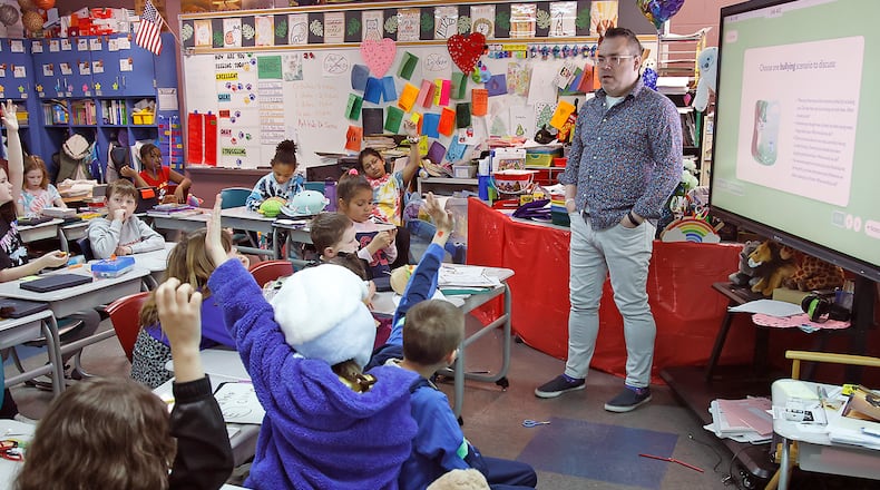 Joseph Fultz, teaches his third grade class as Simon Kenton Elementary Thursday, March 7, 2024. BILL LACKEY/STAFF