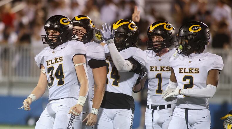 Centerville players, including Lucas Mullinger (34), react after a defensive stop against Fairmont on Friday, Sept. 13, 2024, at Roush Stadium. David Jablonski/Staff