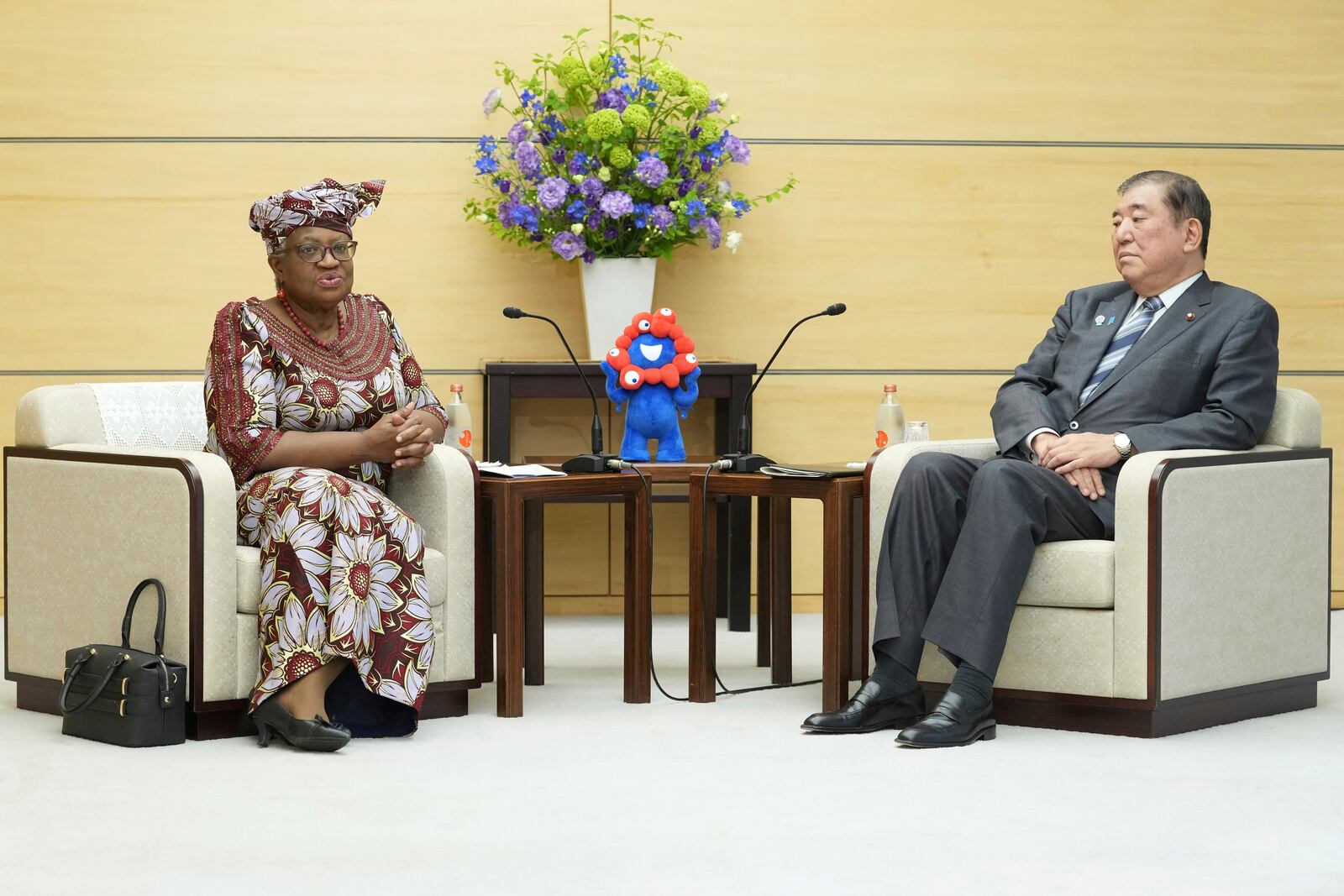 World Trade Organization (WTO) Director-General Ngozi Okonjo-Iweala, left, meets with Japan's Prime Minister Shigeru Ishiba at the latter's office in Tokyo Tuesday, May 13, 2025. (Kazuhiro Nogi/Pool Photo via AP)