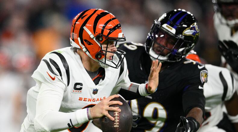 Cincinnati Bengals quarterback Joe Burrow (9) looks to pass in the first half of an NFL football game against the Baltimore Ravens in Baltimore, Thursday, Nov. 16, 2023. (AP Photo/Nick Wass)
