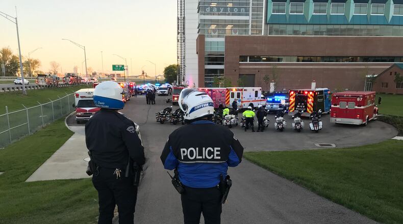File - First responders flashed "Goodnight Lights" for Dayton Children’s Hospital patients on July 9, 2020. While the tradition began in September 2018, it took on a special meaning during the COVID-19 pandemic as measures to limit the spread of infection meant few visitors for the young patients beyond a parent or legal guardian. JIM NOELKER/STAFF