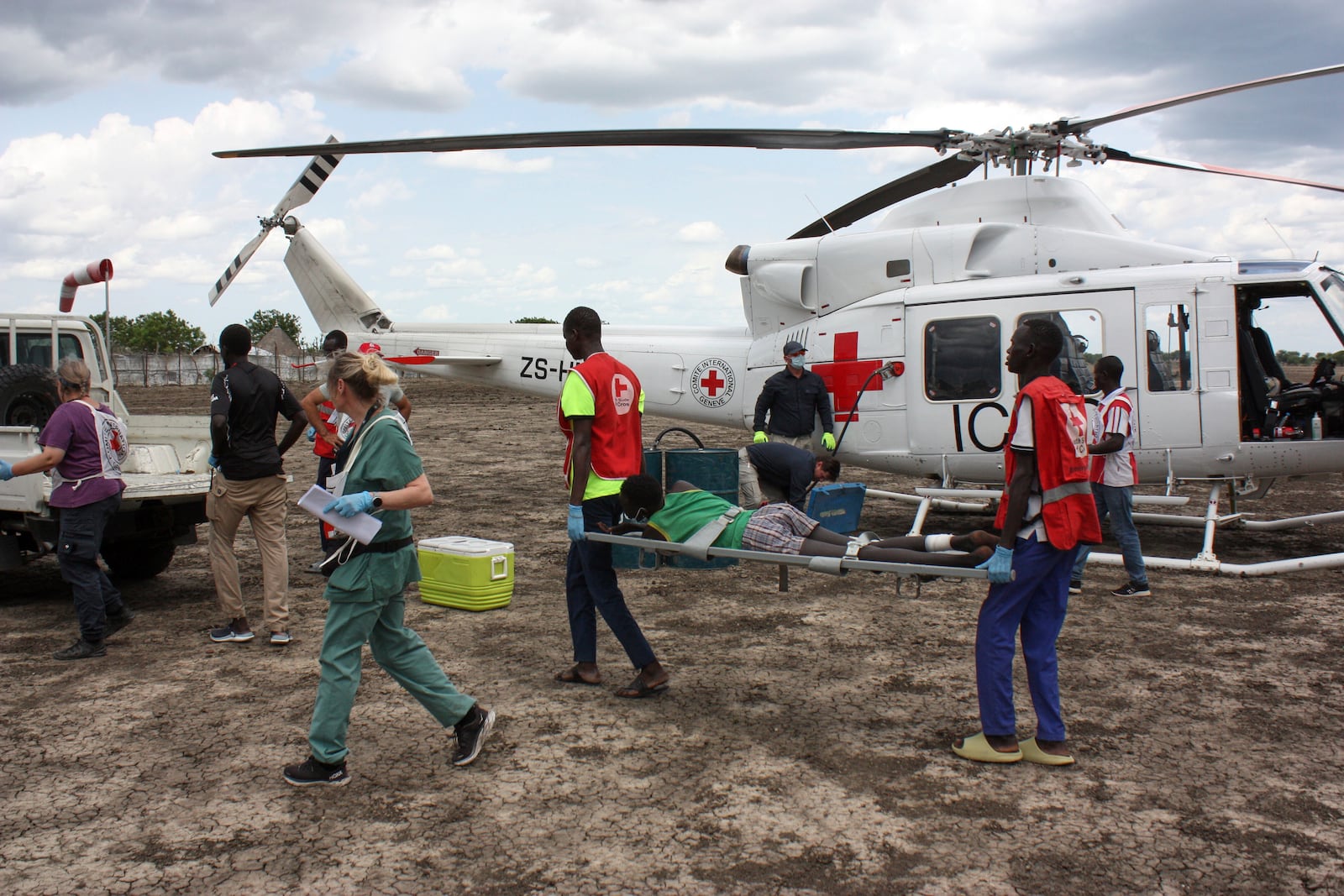 Medical staff with the International Committee of the Red Cross (ICRC) and South Sudan Red Cross, move a weapon-wounded patient to an ambulance in Akobo, South Sudan, Saturday, May 24, 2025. (AP Photo/Joseph Falzetta)
