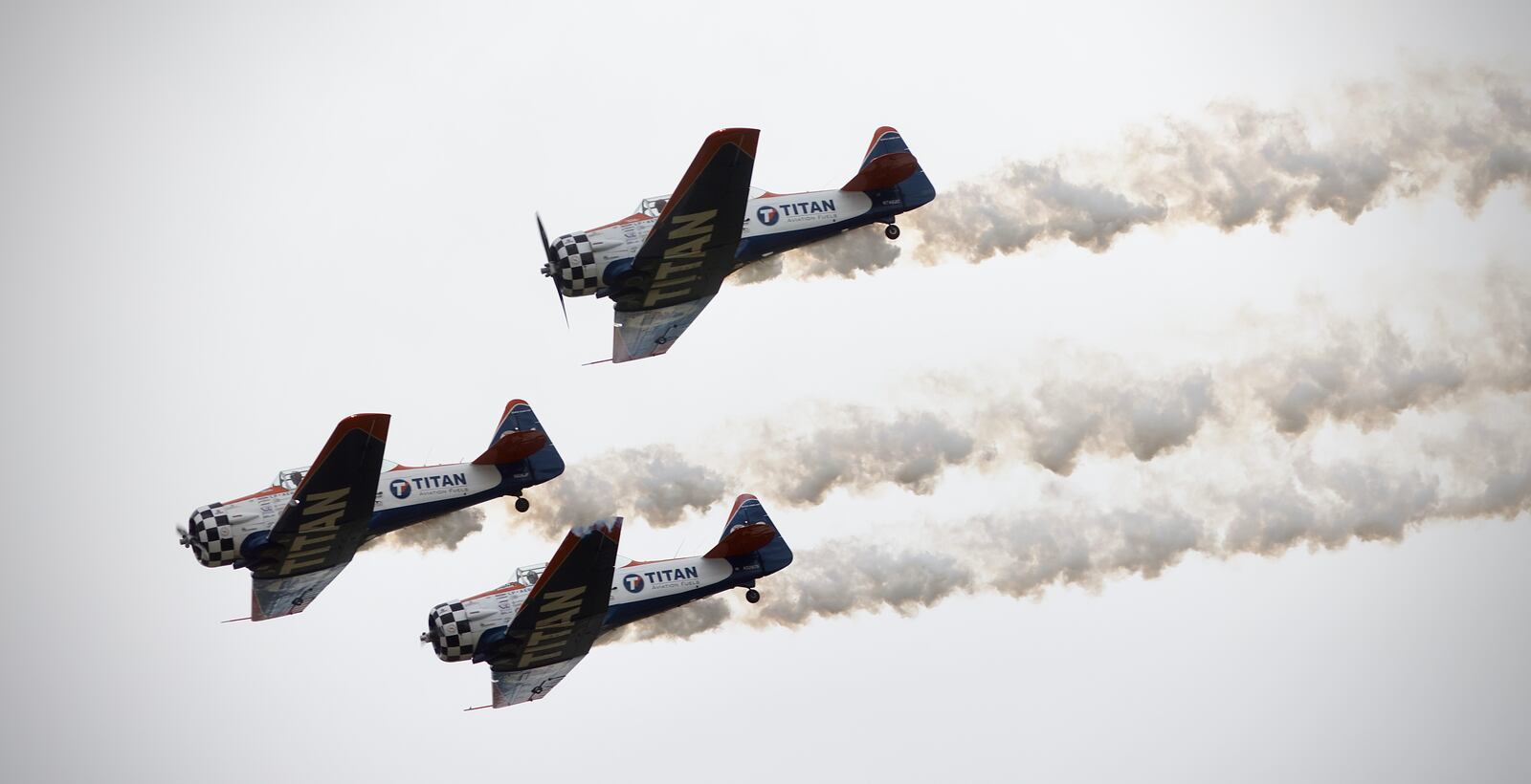 The Titan Aerobatic Team flies in formation at the Dayton Air Show on Sunday, June 23, 2024. MARSHALL GORBY / STAFF