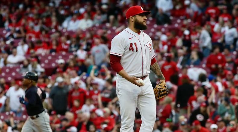 Reds reliever Daniel Duarte reacts after giving up a grand slam to Jose Ramirez, of the Guardians, in the ninth inning on Tuesday, April 12, 2022, at Great American Ball Park in Cincinnati. David Jablonski/Staff