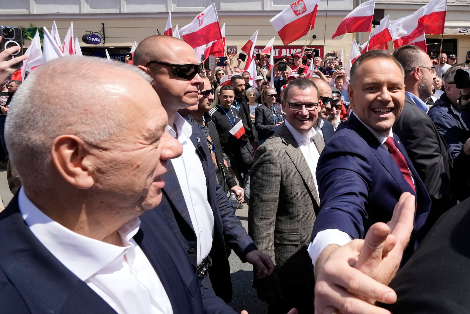 Conservative presidential candidate Karol Nawrocki, front right, takes part in a march one week ahead of a decisive election in Warsaw Poland on Sunday, May 25, 2025. (AP Photo/Czarek Sokolowski)