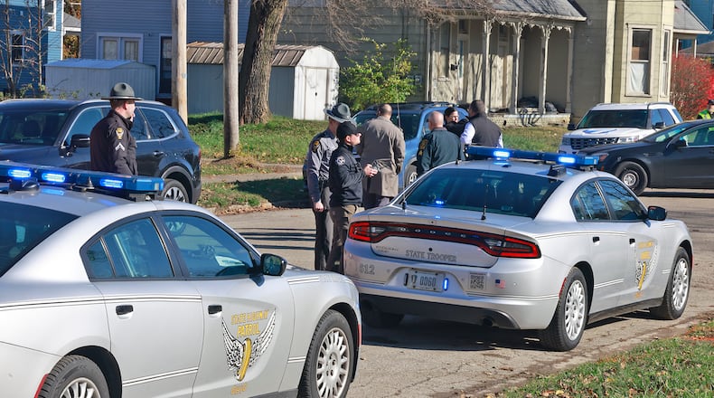 Springfield Police and the State Highway Patrol investigate crash in an alley between Southern Avenue and Johnny Lytle that possibly is connected to a shooting in the one hundred block of West Southern Avenue Tuesday, Nov. 26, 2024. BILL LACKEY/STAFF