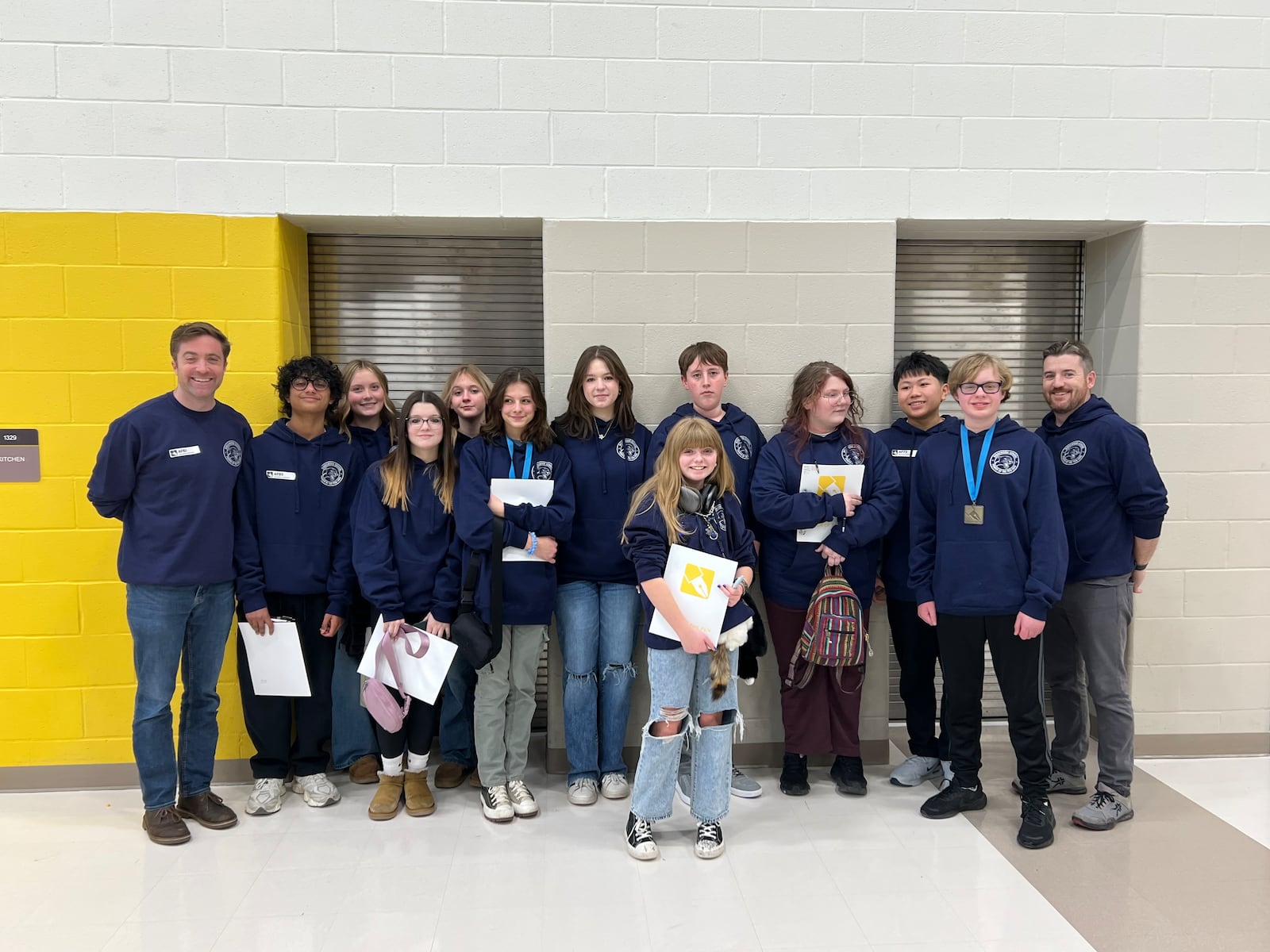 Ridgewood School with Coaches Paul Sauter and Aaron Guest during the second round of Western Region 7th and 8th grade creative writing Power of the Pen tournament. Contributed