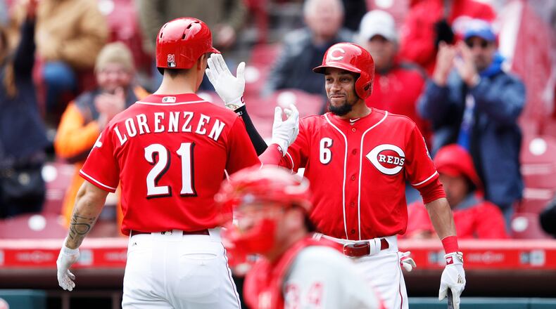 CINCINNATI, OH - APRIL 06: Michael Lorenzen #21 of the Cincinnati Reds is congratulated by Billy Hamilton #6 after hitting a solo home run to break a tie in the sixth inning of the game against the Philadelphia Phillies at Great American Ball Park on April 6, 2017 in Cincinnati, Ohio. (Photo by Joe Robbins/Getty Images)