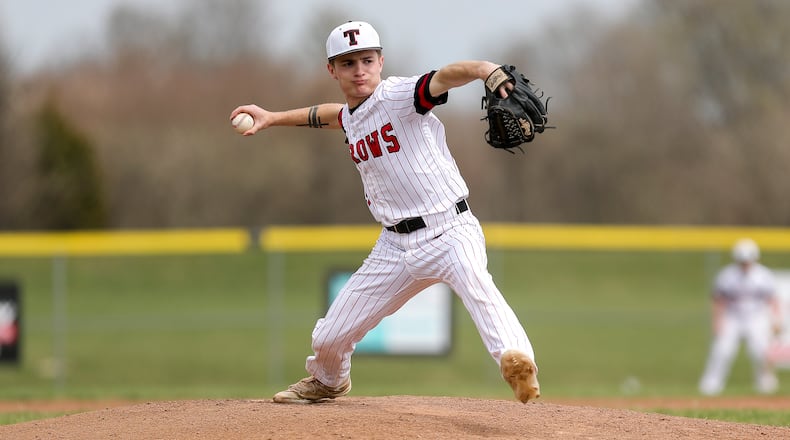 Tecumseh High School junior Colton Bower delivers a pitch during their game against Sidney earlier this season in New Carlisle. Michael Cooper/STAFF