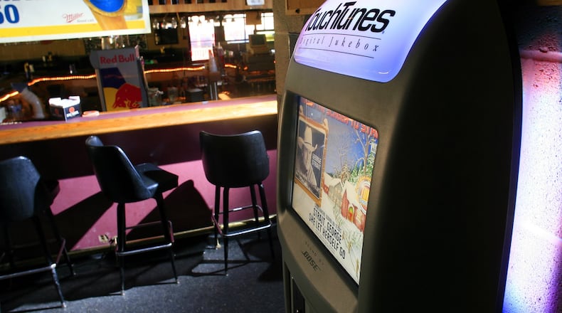 A TouchTunes digital jukebox is seen on the wall of a bar near Middletown. FILE PHOTO