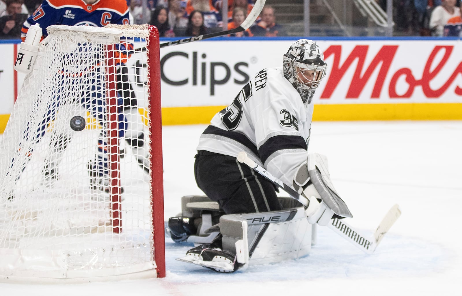 Los Angeles Kings goalie Darcy Kuemper (35) makes a save against the Edmonton Oilers during the second period of an NHL hockey game in Edmonton, Alberta, Thursday, May 1, 2025. (Jason Franson/The Canadian Press via AP)