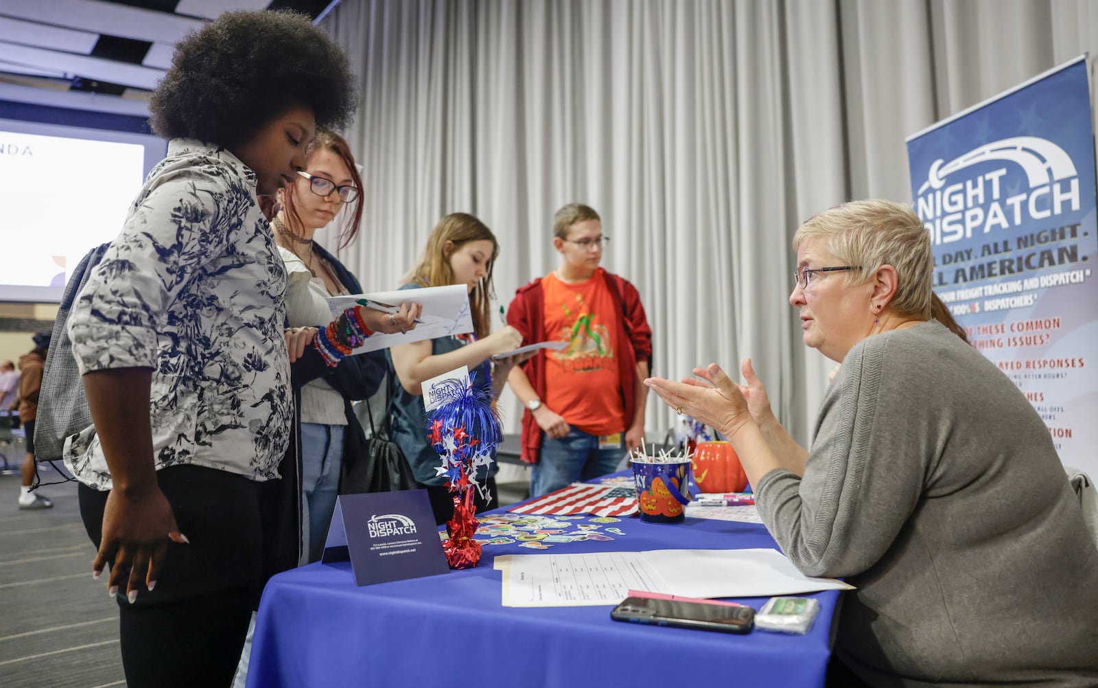 Peggy Phillips, quality assurance specialist at Night Dispatch, talks to high school students about different opportunities during Discovery Day on Tuesday, September 30, 2025, at the Hollenbeck Bayley Center. JOSEPH COOKE/STAFF
