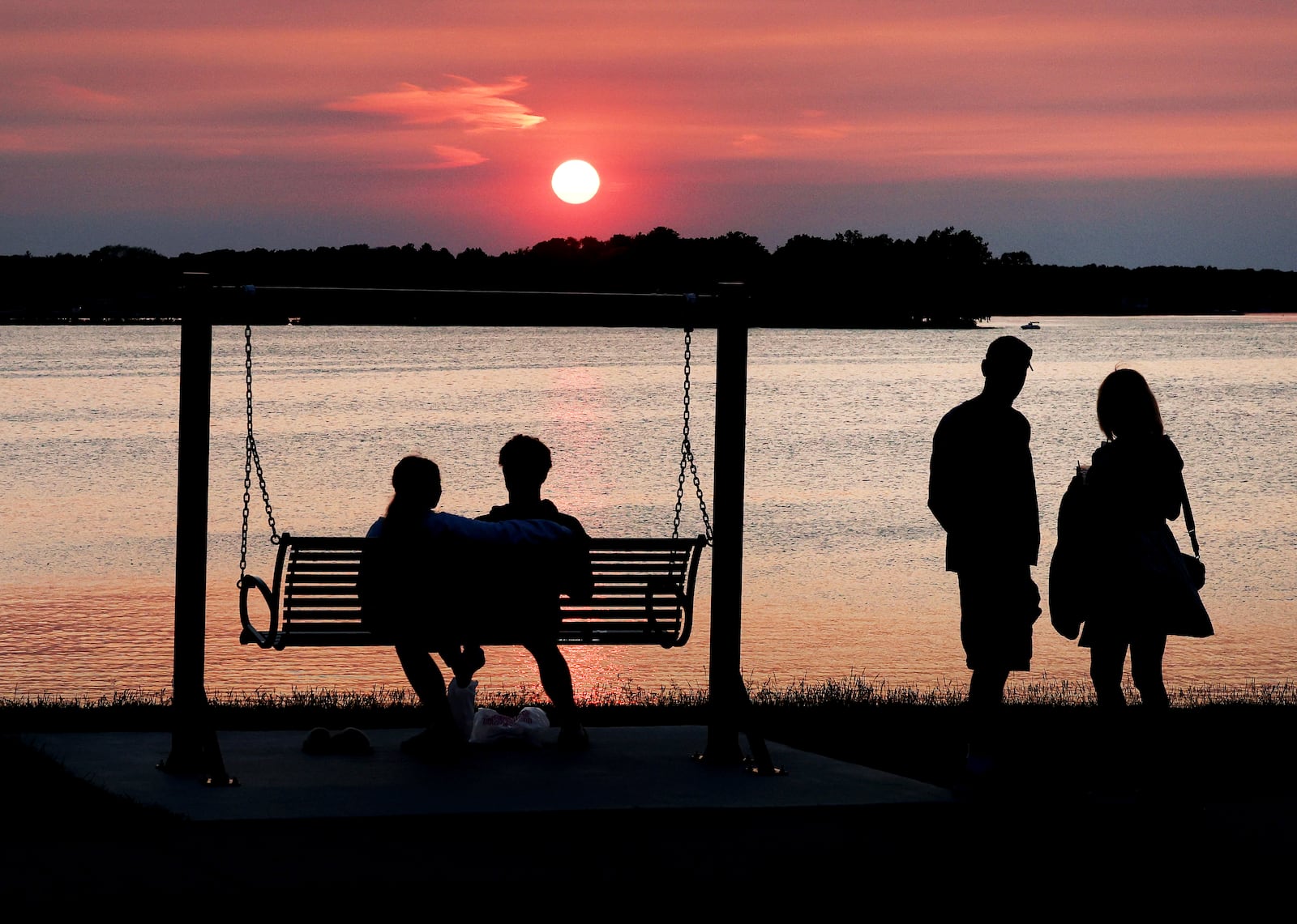FILE - Smoke from Canadian wildfires is visible at sunset in Oconomowoc, Wis., June 1, 2025. (John Hart/Wisconsin State Journal via AP)