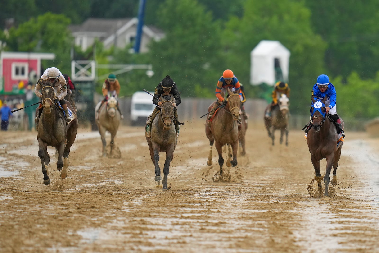 Margie's Intention, far left, with jockey Flavien Prat, edges out Paris Lily, with jockey Joel Rosario, to win the 149th running of the Black-Eyed Susan horse race Friday, May 16, 2025, in Baltimore. (AP Photo/Nick Wass)