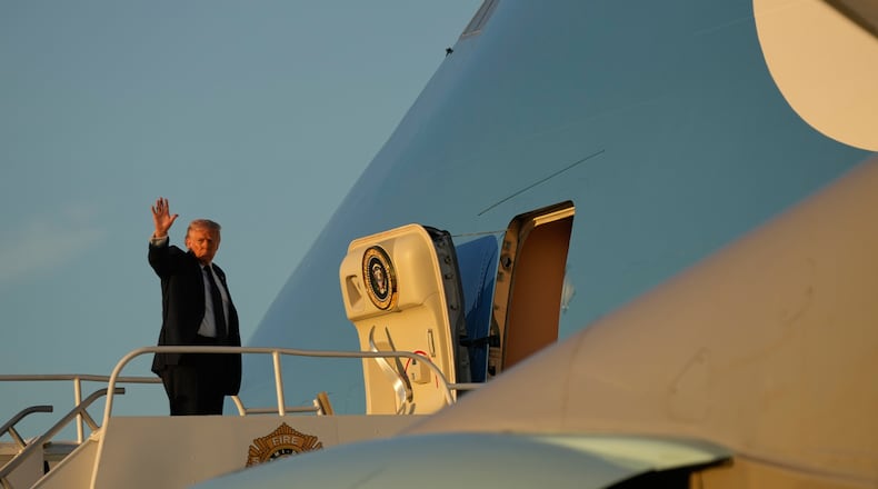 President Donald Trump waves as he boards Air Force One, Monday, March 9, 2026, at Miami International Airport in Miami. (AP Photo/Mark Schiefelbein)