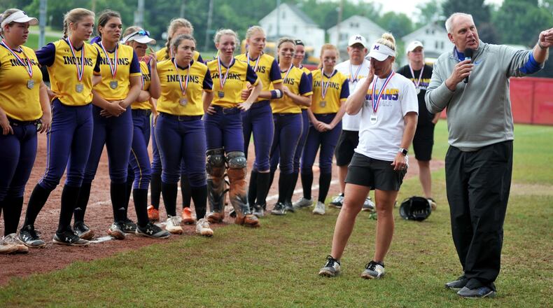Ohio High School Athletic Association executive director Jerry Snodgrass points to the Mechanicsburg crowd during the trophy presentation Sunday after the Indians lost to Antwerp 5-0 in the Division IV state championship softball game at Firestone Stadium in Akron. RICK CASSANO/STAFF