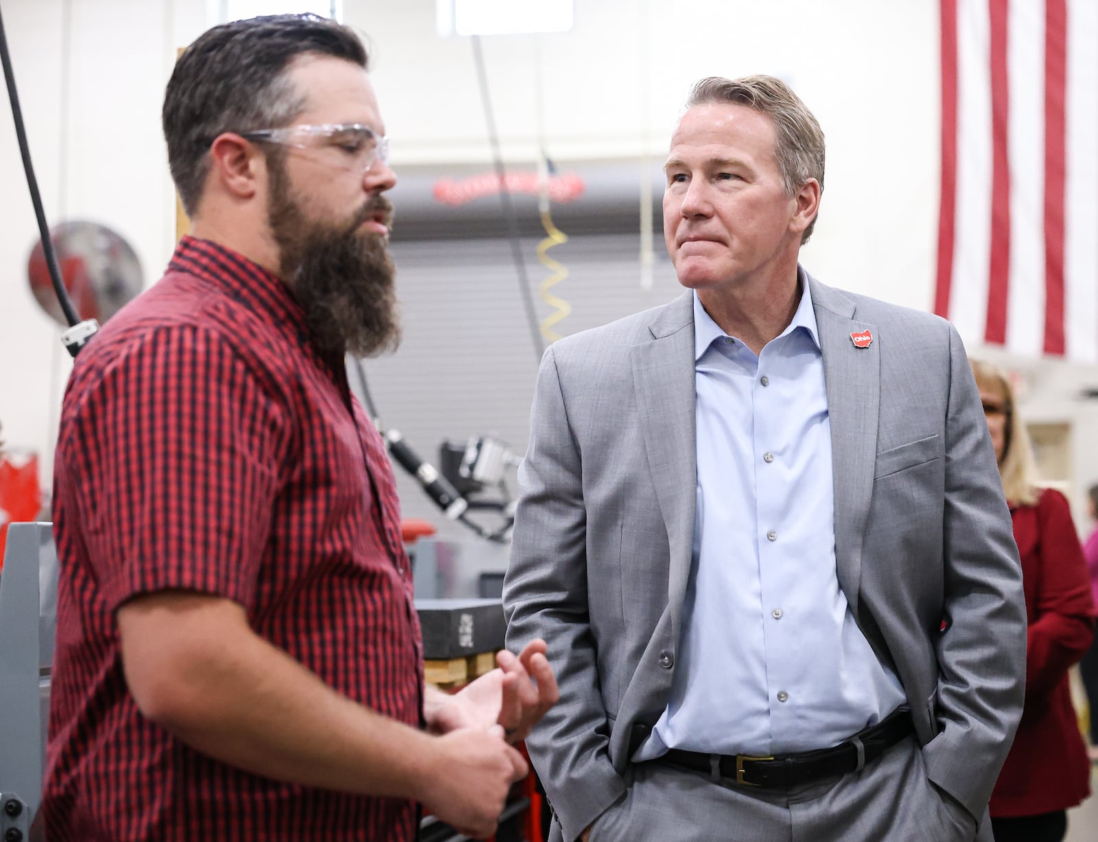Sen. Jon Husted listens as Stebbins High School instructor David Curley explains what he teaches on Friday, Sept. 5. Husted toured the school's career technology center and stopped in Curley's advanced manufacturing and machining classroom. BRYANT BILLING / STAFF