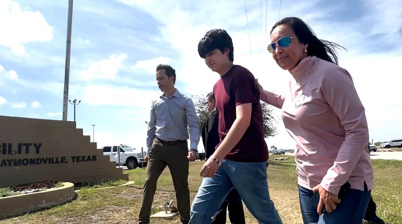 Antonio Gamez CuÈllar, 18, walks out of the El Valle Detention Facility in Raymondville, Texas on Monday, March 9, 2026 escorted by his attorneys, EfrÈn C. Olivares and Carlos M. Garcia, and Republican congresswoman Monica de la Cruz of District 15. (AP Photo/Valerie Gonzalez)