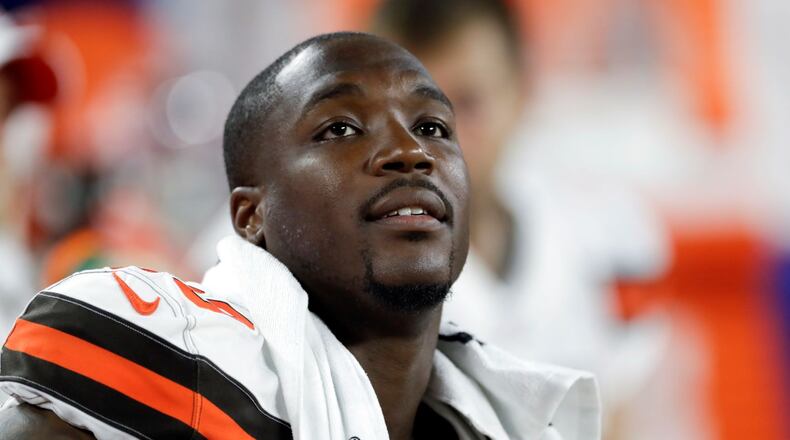 FILE - In this Aug. 8, 2019, file photo, Cleveland Browns defensive end Chris Smith (50) sits on the sideline during the first half of an NFL preseason football game against the Washington Redskins in Cleveland. Petara Cordero, the girlfriend of Smith has been killed in an accident early Wednesday, Sept. 11, 2019. The team said Cordero, 26, died when she was struck by an oncoming car on I-90 West at around 2 a.m. after she and Smith had pulled to the side of the road when the car he was driving had a tire malfunction and spun out. (AP Photo/Ron Schwane, File)