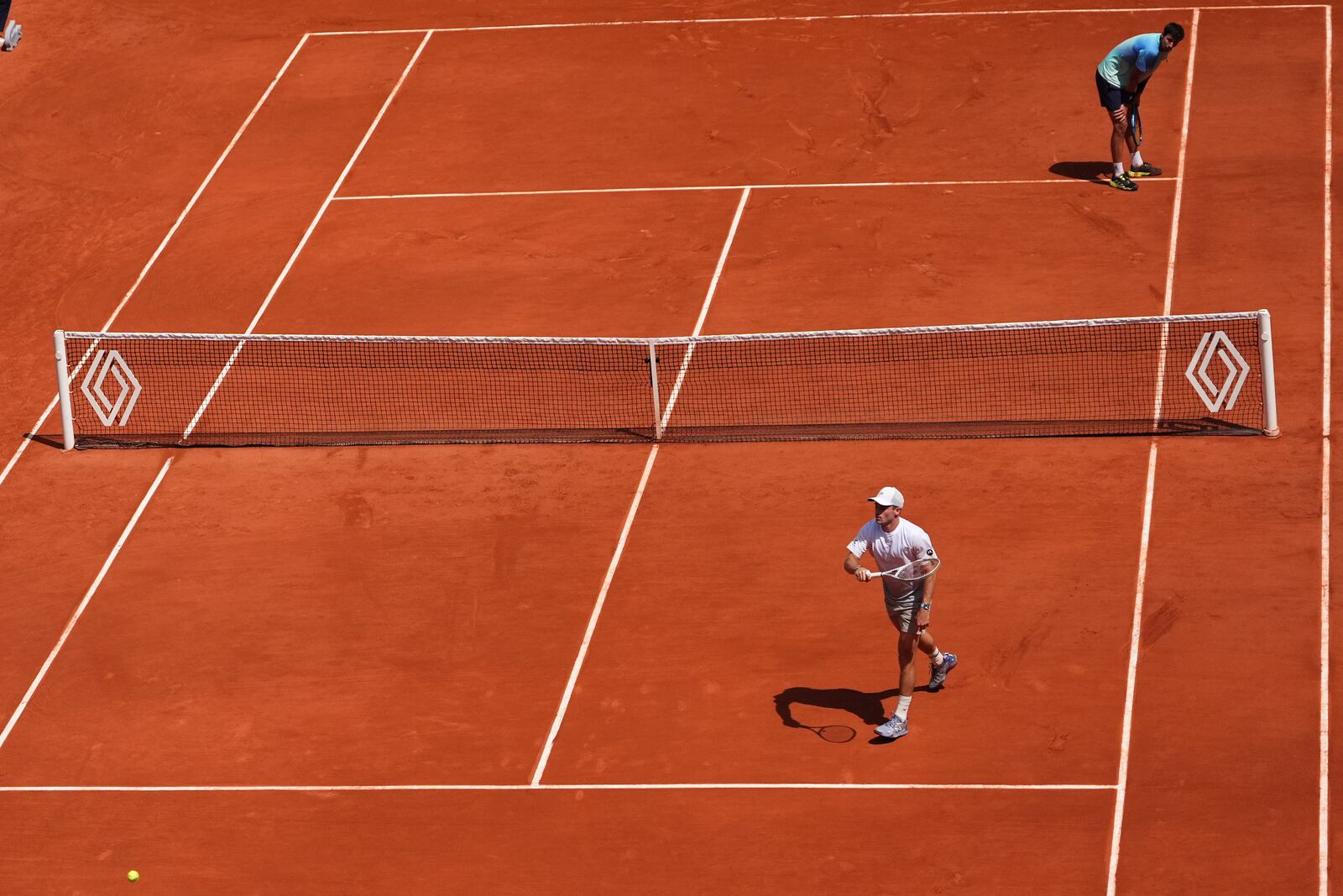 Tommy Paul of the U.S. reacts winning a point to Australia's Alexei Popyrin, top right, during their fourth round match of the French Tennis Open, at the Roland-Garros stadium, in Paris, Sunday, June 1 2025. (AP Photo/Lindsey Wasson)