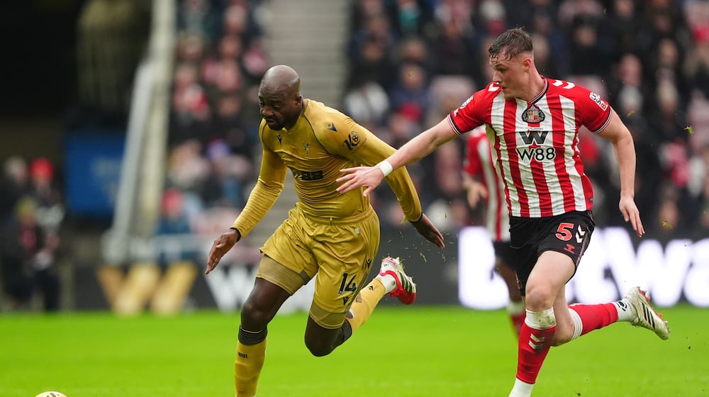 Crystal Palace's Jean-Philippe Mateta, left, and Sunderland's Daniel Ballard in action during the English Premier League soccer match between Sunderland and Crystal Palace in Sunderland, England, Saturday Jan. 17, 2026. (Owen Humphreys/PA via AP)