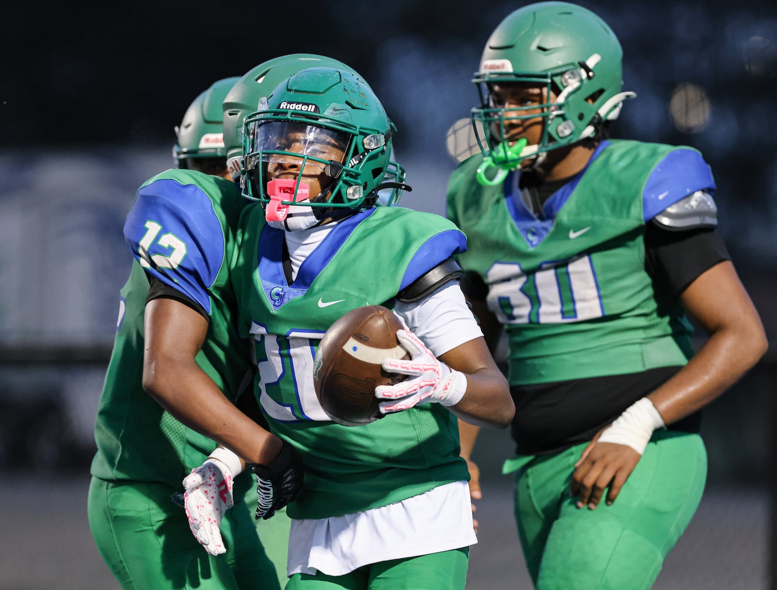 Chaminade-Julienne players celebrate during their scrimmage game against Sidney on Friday, Aug. 15 at Roger Glass Stadium. BRYANT BILLING / STAFF
