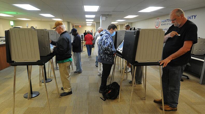Voters at the Montgomery County Board of Elections Wednesday Oct. 12, 2022. Early voting started Wednesday in Ohio. Election officials expect a large turnout of early voters this year. MARSHALL GORBY\STAFF