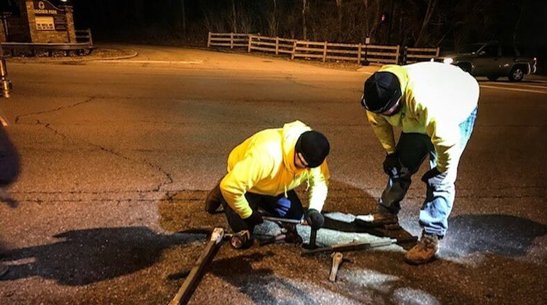 Montgomery County Water personnel work on a valve under Shourp Mill Road on Feb. 13, 2019. A large water main break cut water service to much of the County and most of it was restored by the next morning. JIM NOELKER / STAFF