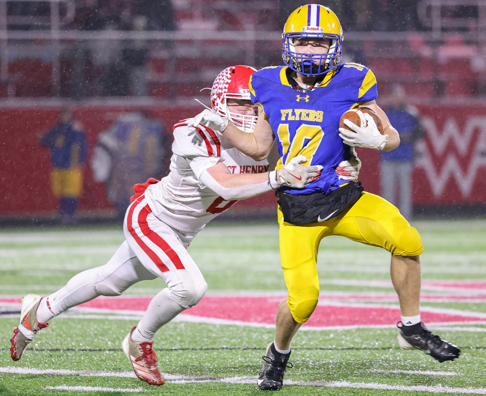 St. Henry senior linebacker Drew Langenkamp tackles Marion Local's Andrew Schmackers during the second quarter of the Division VII, Region 28 championship on Friday, Nov. 21 at Mercy Health/Wapak VFW Field. BRYANT BILLING/STAFF
