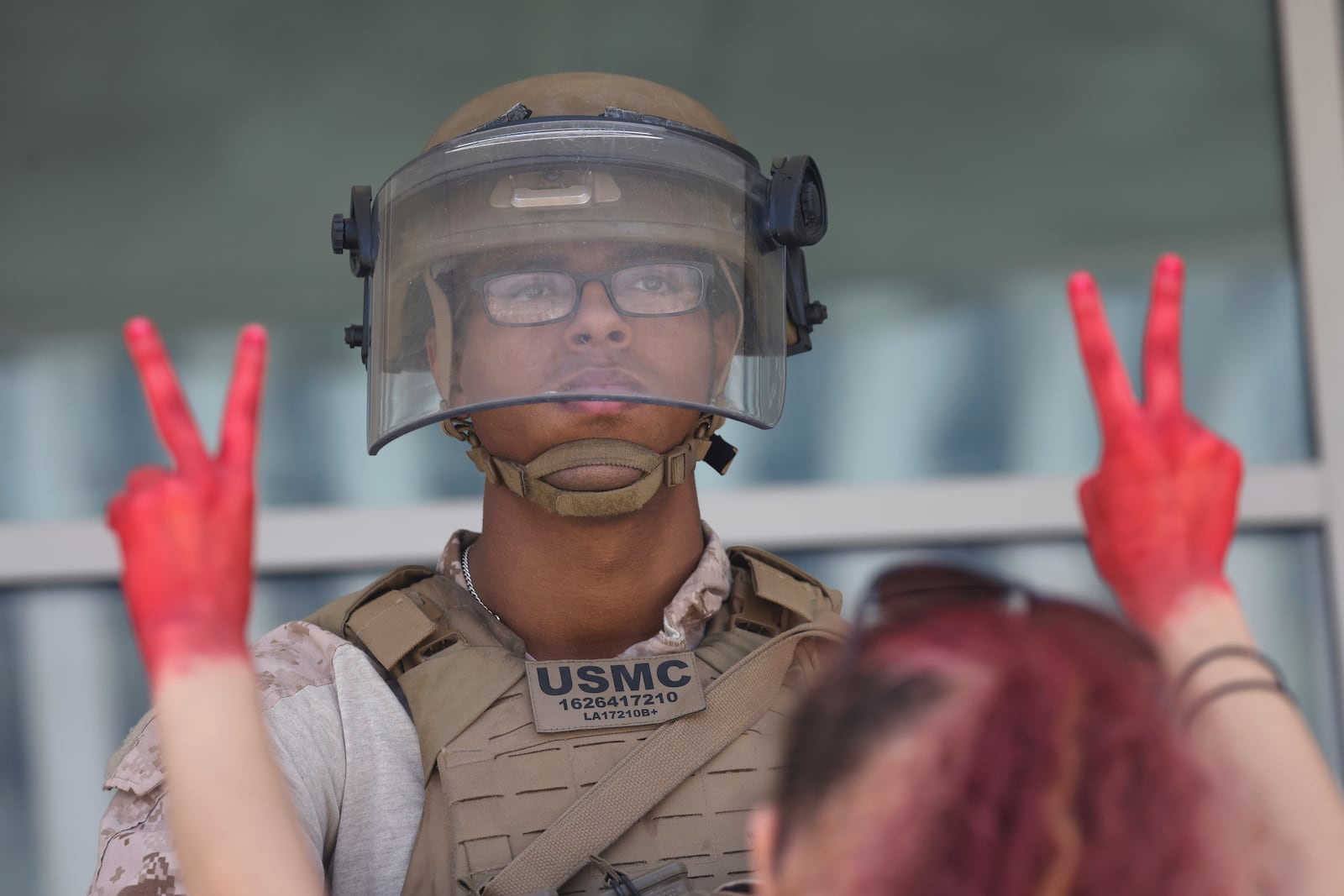 FILE - Protesters confront Marines outside the Federal Building on July 4, 2025 in Los Angeles. (AP Photo/Jill Connelly, file)