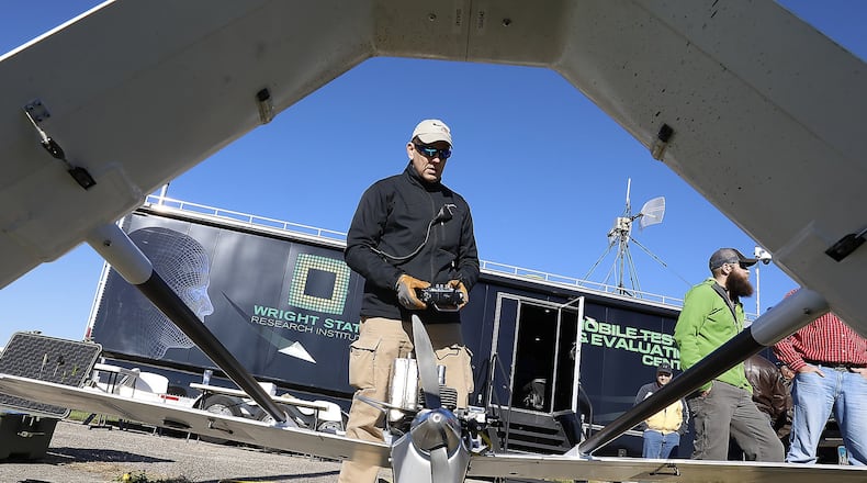 Dave Malek performs a safety check on a UAV before it takes off for one of the Air Force Research Labratory’s test flights at Springfield Beckley Municipal Airport. Bill Lackey/Staff
