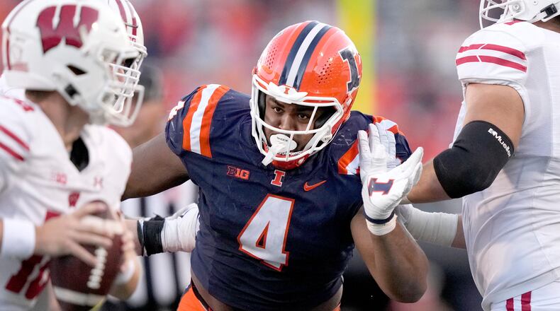 FILE - Illinois defensive lineman Jer'Zhan Newton rushes the quarterback during an NCAA college football game against Wisconsin, Saturday, Oct. 21, 2023, in Champaign, Ill. (AP Photo/Charles Rex Arbogast, File)