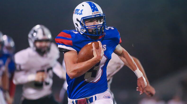Greeneview High School junior quarterback Cole DeHaven runs the ball during a game against Greenon on Friday night at Don Nock Field in Jamestown. The Rams won the OHC South title, beating the Knights 28-14. CONTRIBUTED PHOTO BY MICHAEL COOPER