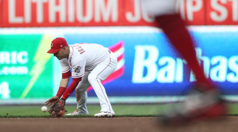 Reds shortstop Jose Iglesias fields a ball against the Braves on Tuesday, April 23, 2019, at Great American Ball Park in Cincinnati. David Jablonski/Staff