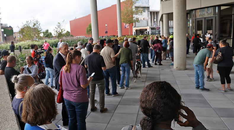 People wait outside Springfield City Hall Forum as they wait to be let in for the City Commission meeting Tuesday, Sept. 25, 2024. BILL LACKEY/STAFF