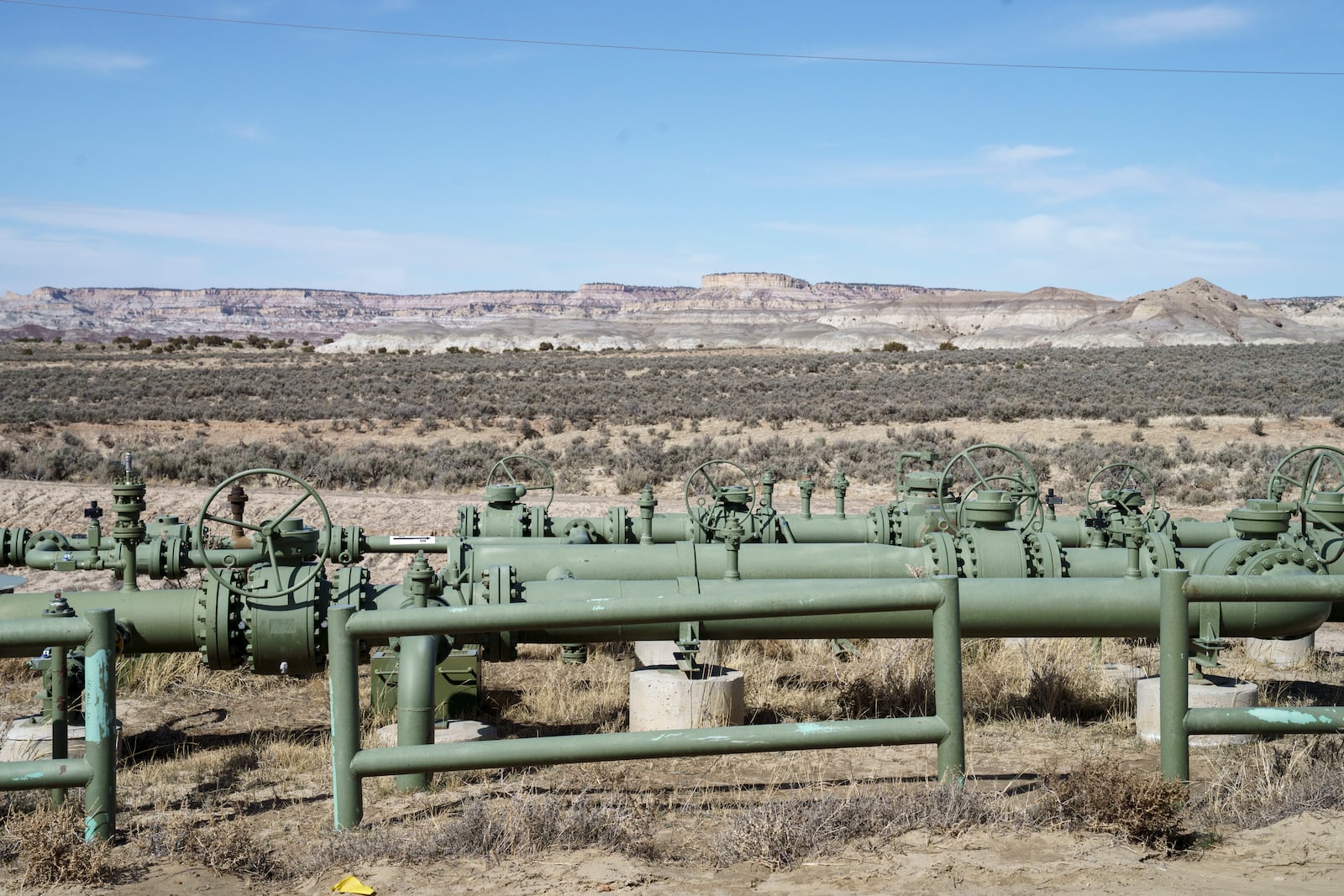 A view of natural gas pipes installed above ground in a field at a well pad in Counselor, N.M., Navajo Nation, on Tuesday March 11, 2025. (Nadav Soroker/Searchlight New Mexico via AP)