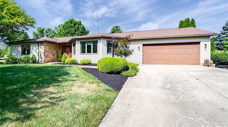 This stone-and-vinyl-sided ranch, originally built in 1991, offers about 1,930 sq. ft. of living space. The owner/builder created the home with wide doorways, motion sensor faucets, remote control window blinds and hallways designed for maximum maneuverability. CONTRIBUTED PHOTO