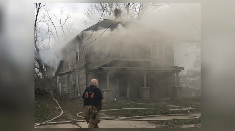 Springfield firefighters battle a fire at a duplex in the 1700 block of Clay Street March 12, 2020. BILL LACKEY/STAFF
