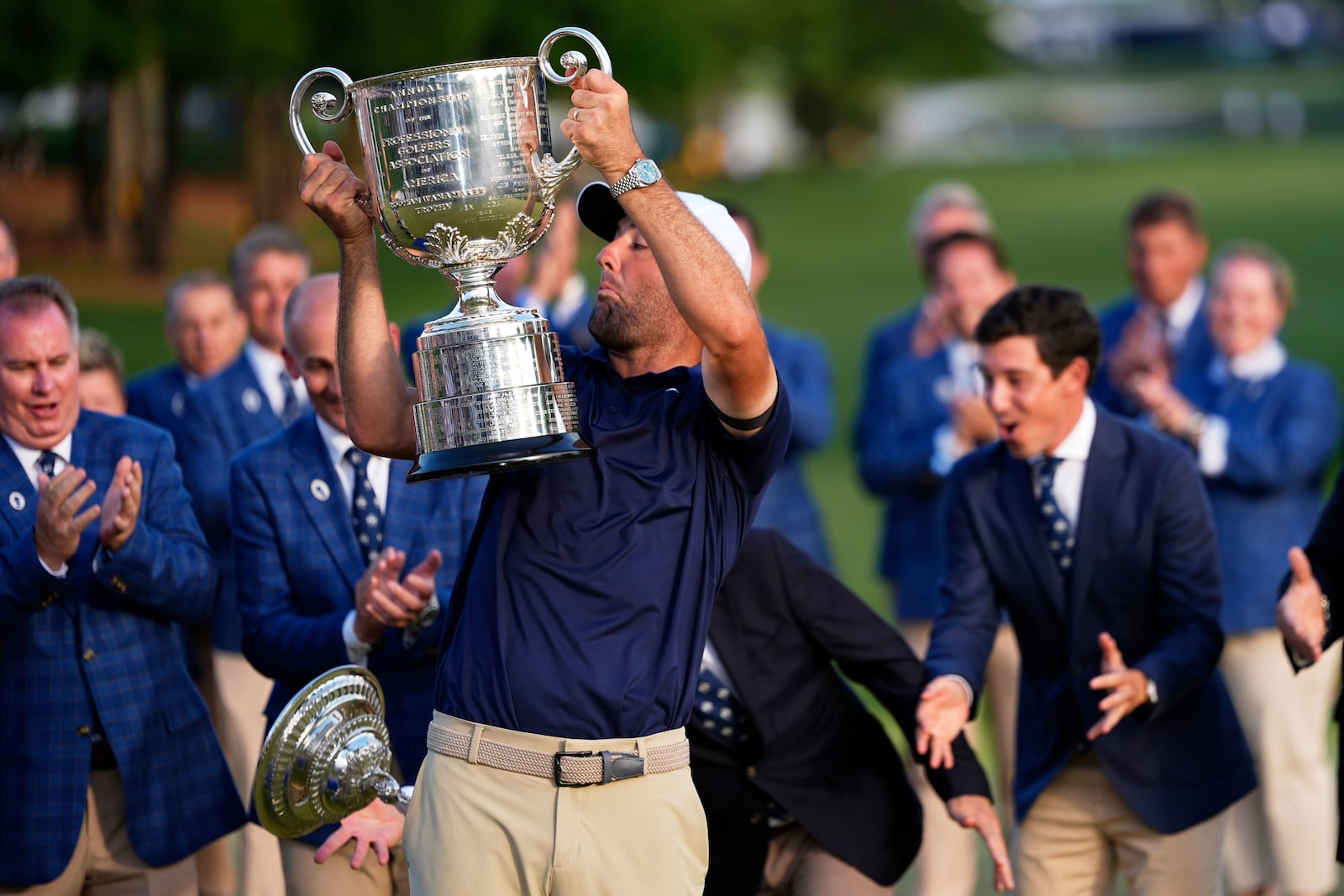 Scottie Scheffler drops the top as he holds the Wanamaker trophy after winning after winning the PGA Championship golf tournament at the Quail Hollow Club, Sunday, May 18, 2025, in Charlotte, N.C. (AP Photo/David J. Phillip)