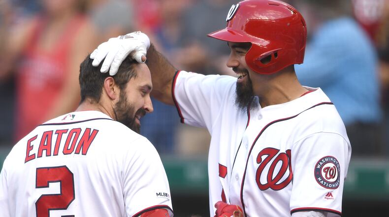 WASHINGTON, DC - AUGUST 14: Adam Eaton #2 of the Washington Nationals celebrates a three home run with Anthony Rendon #6 in the fifth inning during a baseball game against the Cincinnati Reds at Nationals Park on August 14, 2019 in Washington, DC. (Photo by Mitchell Layton/Getty Images)