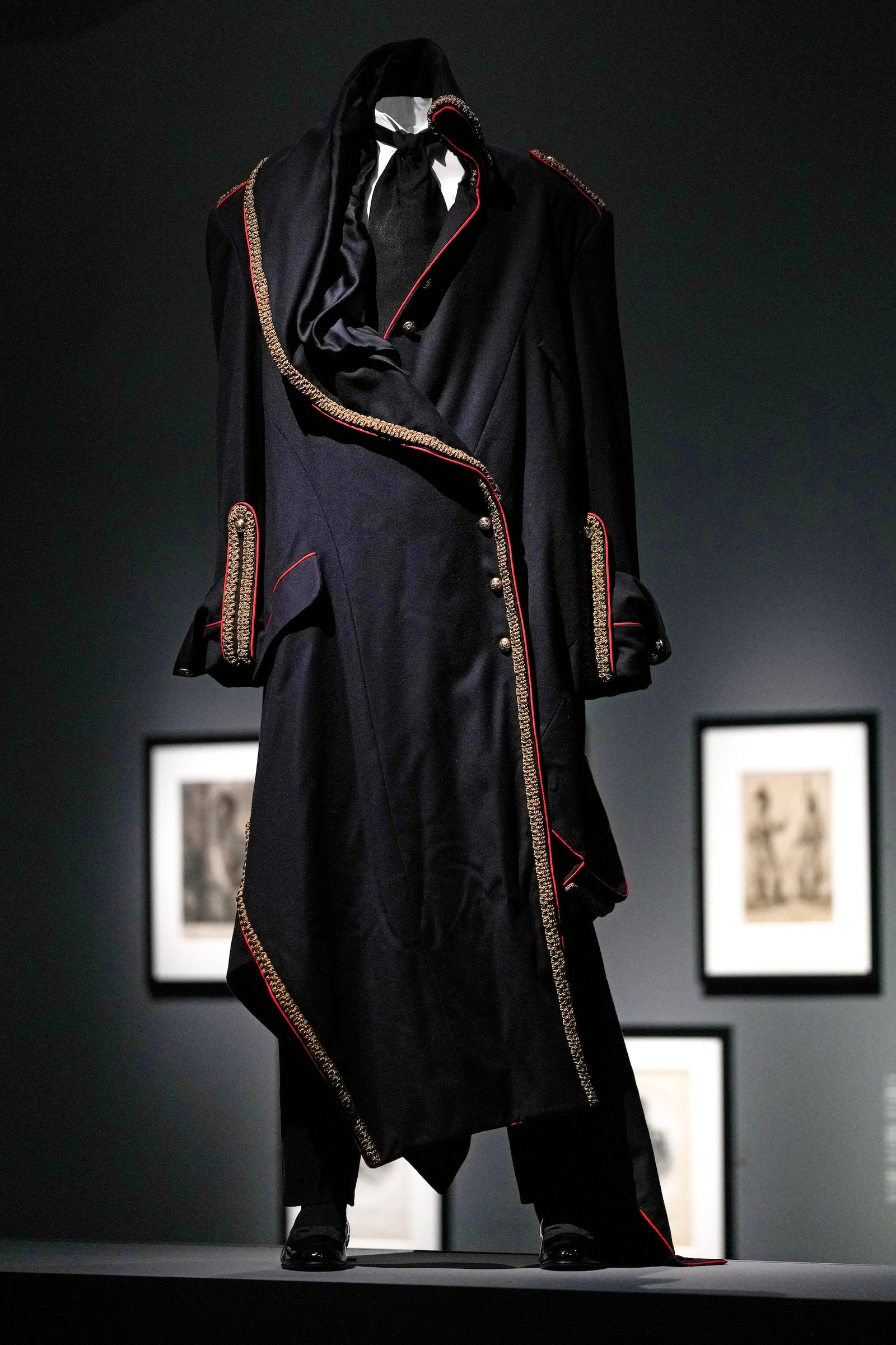 A coat designed by John Galliano for the House of Dior and worn by André Leon Talley is displayed at the Metropolitan Museum of Art's Costume Institute exhibition, "Superfine: Tailoring Black Style," on Saturday, May 3, 2025, in New York. (Photo by Charles Sykes/Invision/AP)