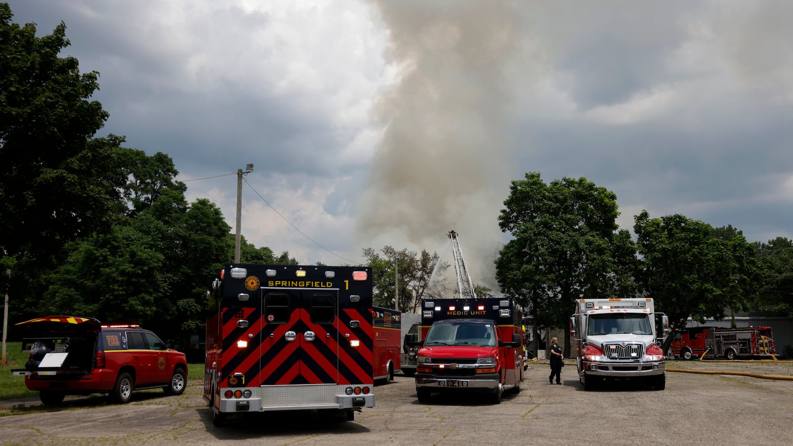 Firefighters work the scene of a fire on Thursday, June 26, 2025, at an abandoned former industrial site on Kenton Street. JOSEPH COOKE/STAFF