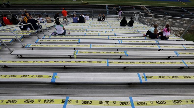 The bleachers were marked so fans could social distance Friday night while watching Springfield play Wayne. BILL LACKEY/STAFF