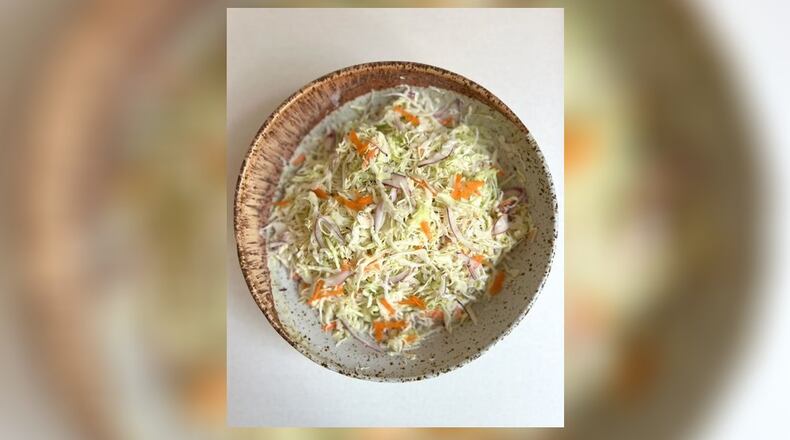 Coleslaw sometimes begs to be thrown on top of a hot sandwich for some added crunch but it can also hold its own as a side to cookout fare. CONTRIBUTED