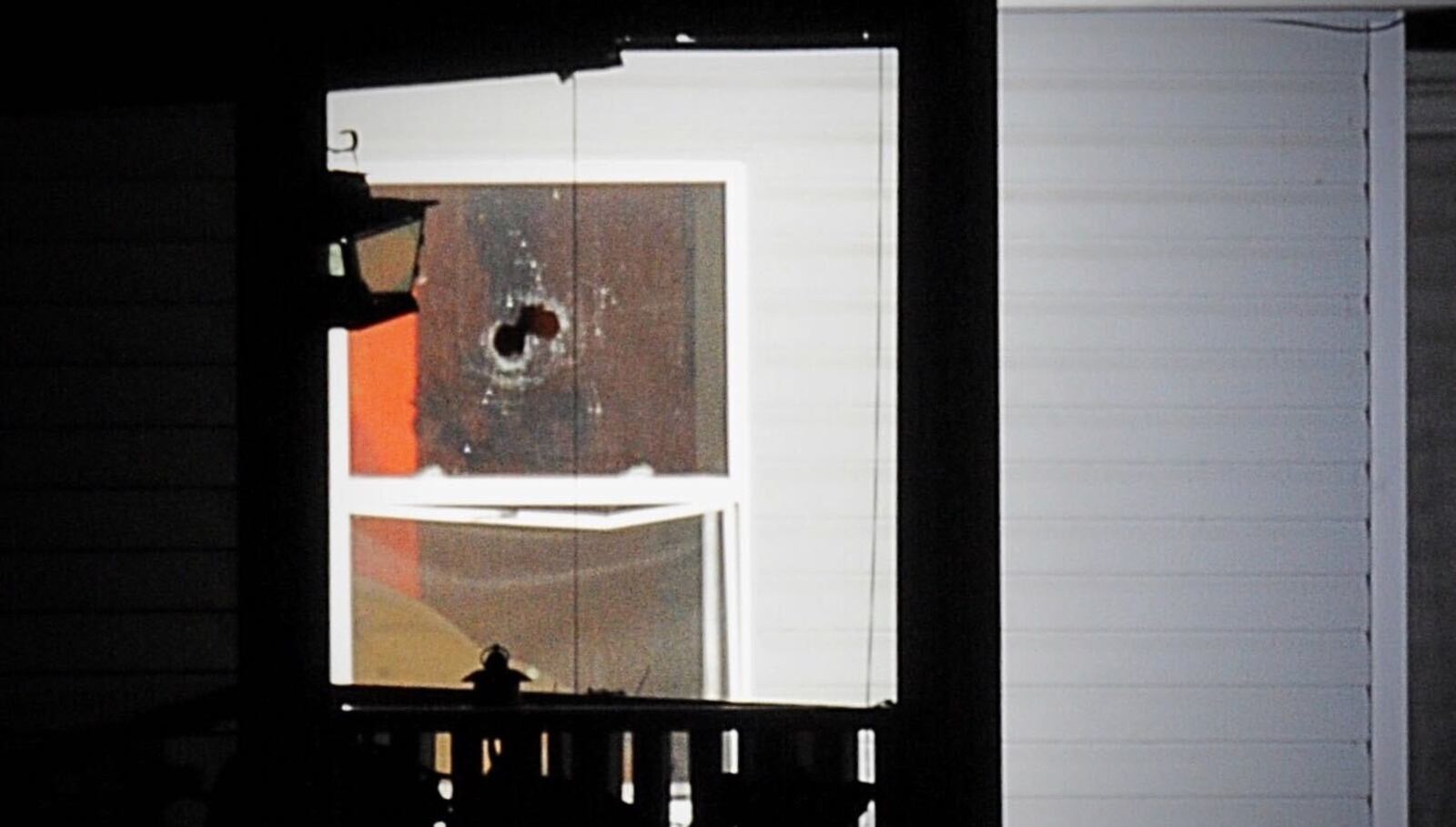 Law enforcement fired a round of what is likely tear gas into a house during a standoff Thursday night, Jan. 28, 2021, in the 200 block of North Park Drive in Clark County. MARSHALL GORBY/STAFF