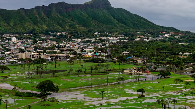 The Ala Wai Golf Course is seen inundated with water from the recent storms, as Hawaiians work to recover from one of the worst floods in decades, in Waikiki, Hawaii, Sunday, March 22, 2026. (Stephen Lam/San Francisco Chronicle via AP)